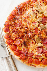 pizza on white wooden background