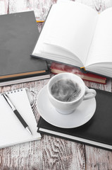 Cup of coffee on a wooden table