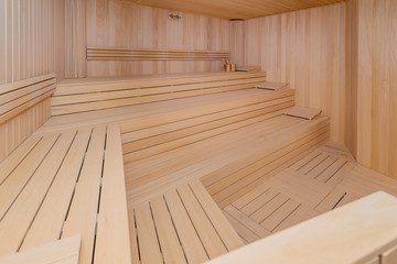 Fototapeta na wymiar Hot wooden sauna room interior
