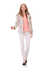 Cute smiling girl in light short coat isolated on white