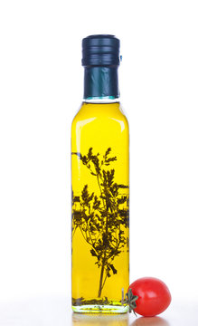 Olive oil in glass bottle  and cherry tomato