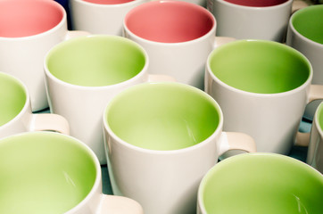 Many two tone color coffee cups/ above view