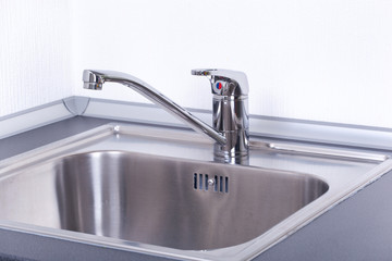 Water tap and sink in a modern kitchen