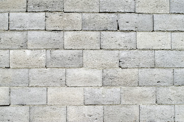 Fototapeta premium Wall of grey concrete blocks