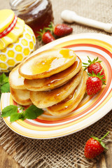 Homemade pancake with honey and strawberry