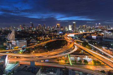 Fototapeta na wymiar Bangkok nightscape / a scene of traffic trail lights on highways at night in the middle of Bangkok City, Thailand