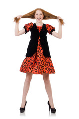 Red hair girl in orange dress isolated on white