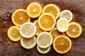 Fototapeta na wymiar stack of citrus fruits slices. Oranges and lemons.
