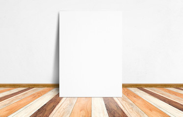 Blank white paper poster at tropical plank wooden floor and whit