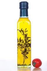 Olive oil in glass bottle  and cherry tomato