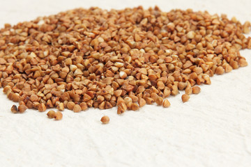 Buckwheat on a rough white fabric background.