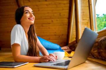 Woman relaxing in wooden house