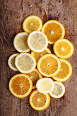 Fototapeta na wymiar stack of citrus fruits slices. Oranges and lemons.