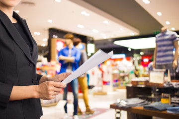 Businesswoman reading a business document.