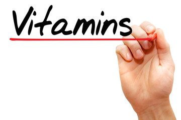 Hand writing Vitamins with marker, business concept