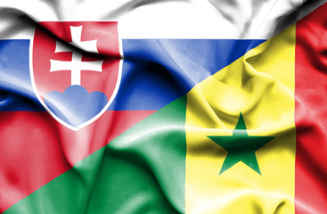 Waving flag of Senegal and Slovak