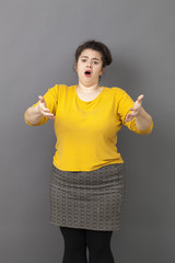 complaining overweight 20's woman expressing exasperation and frustration in front of someone