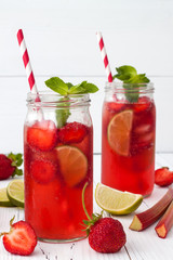 Summer homemade strawberry cocktail with rhubarb, lime and mint