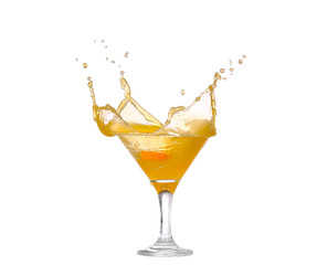 splash of orange juice in a glass isolated on white