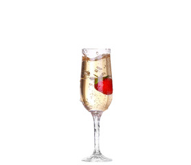 Single Strawberry splashing into a glass of champagne