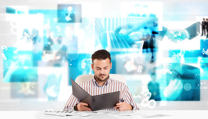 Obraz premium Business person at desk with modern tech images at background