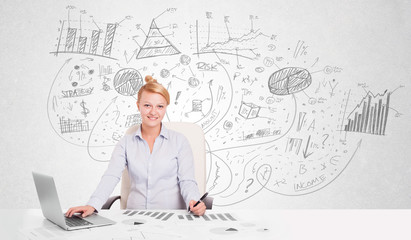 Business woman at desk with hand drawn charts