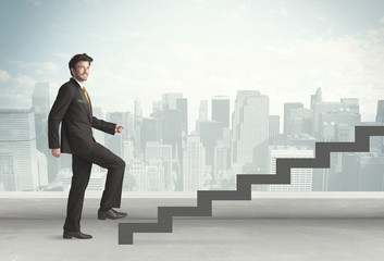 Business person in front of a staircase