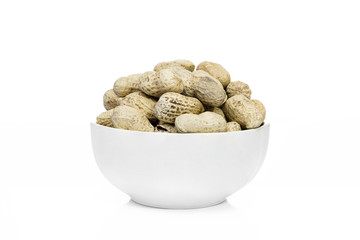 Many Peanuts or groundnut drying in a white bowl  on white backg