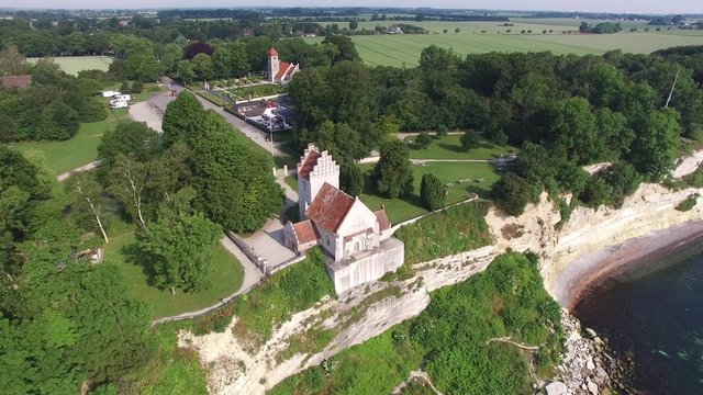 Aerial view of Stevns cliff and Hoejerup Old Church located in Zealand, Denmark
