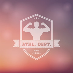 vintage emblem with posing athlete on shield, blur background