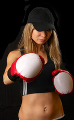 Beautiful girl in boxing gloves