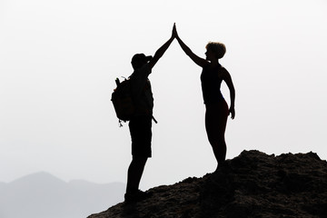 Happy couple celebrate reaching life goal and success concept