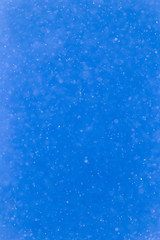 snowing on a blue sky