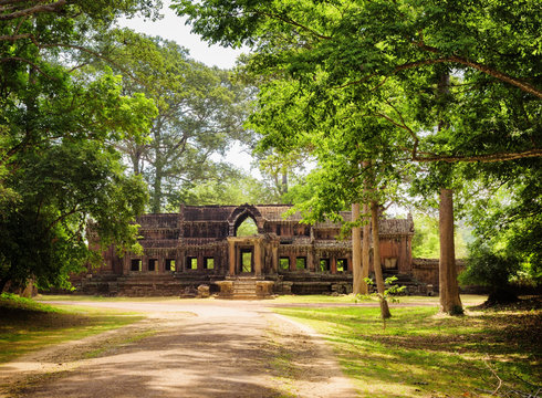 Road in rainforest and Ta Kou Entrance in Angkor Wat, Cambodia