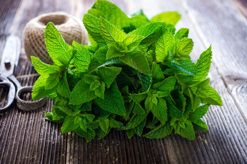 Mint on natural wooden background