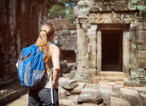 Tourist looking at the Preah Khan temple in Angkor, Cambodia