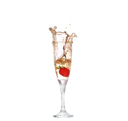 Single Strawberry splashing into a glass of champagne