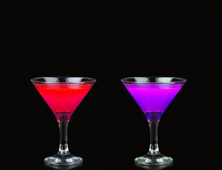 Cosmopolitan cocktail in nice red, purple  in front of a black background