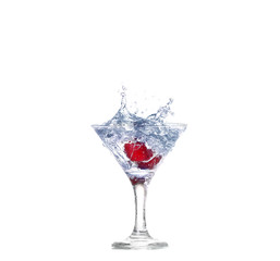 cherry splash in a cocktail glass on white