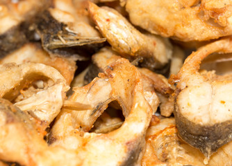 fish is fried in a pan