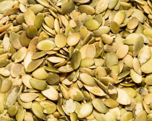 pumpkin seeds as a background. close