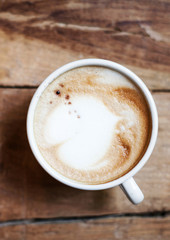 Cup of Coffee for breakfast on rustic wooden table, top view. Ca