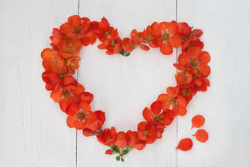 Flower heart on vintage wooden background. Valentin day or wedding concept