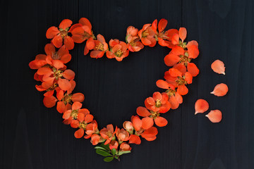 Flower heart on wooden background. Valentin day or wedding concept