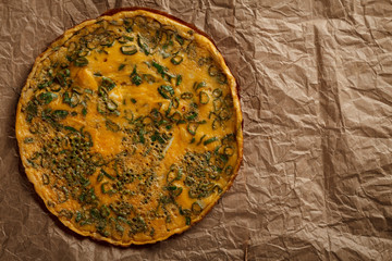 Omelette on old crumpled paper