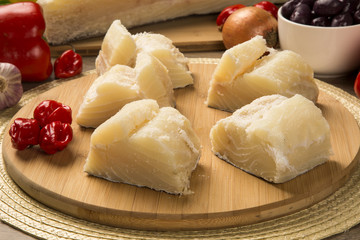 salted codfish on the wooden table with ingredients