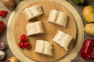 salted codfish on the wooden table with ingredients
