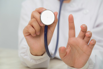 Doctor with stethoscope in the hands