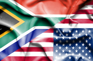 Waving flag of United States of America and South Africa