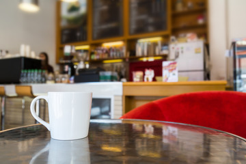Coffee cup on table in cafe